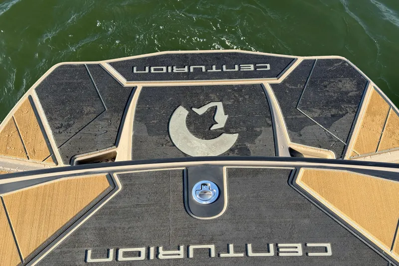 Slide: The Image of 2025 Centurion Ri245 boat deck with logo, on water. - 17
