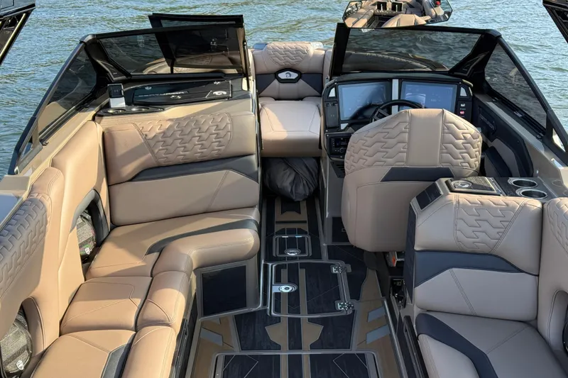 Slide: The Image of Luxurious interior of 2025 Centurion Ri245 boat with plush seating and modern dashboard. - 19