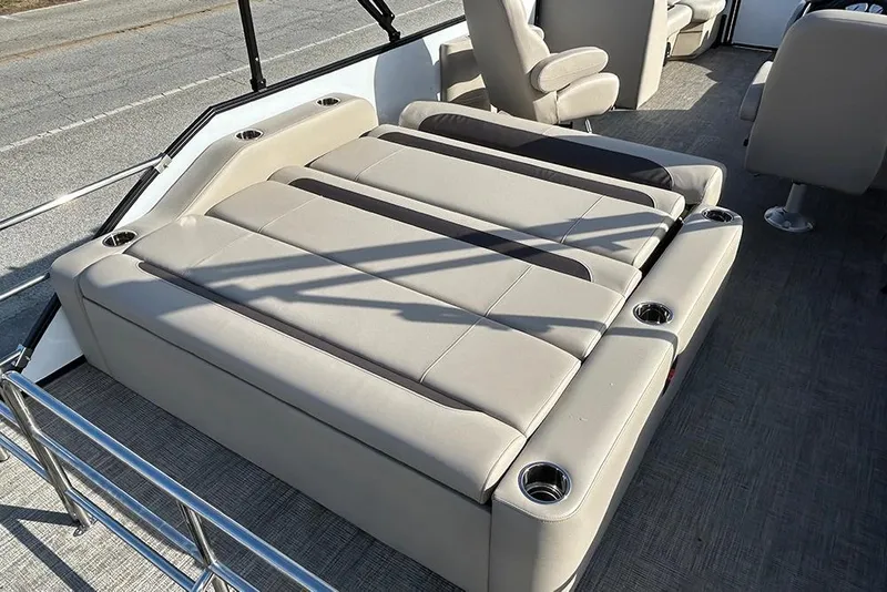 Slide: The Image of 2026 Bentley Pontoons Legacy 223 Swingback with luxurious seating and cup holders. - 13
