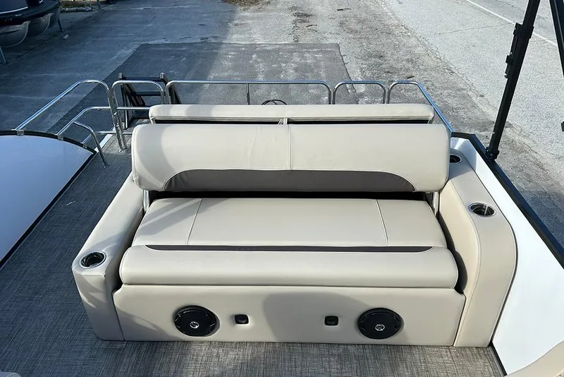 Slide: The Image of 2026 Bentley Pontoons Legacy 223 Swingback interior seating with cup holders and speaker. - 16