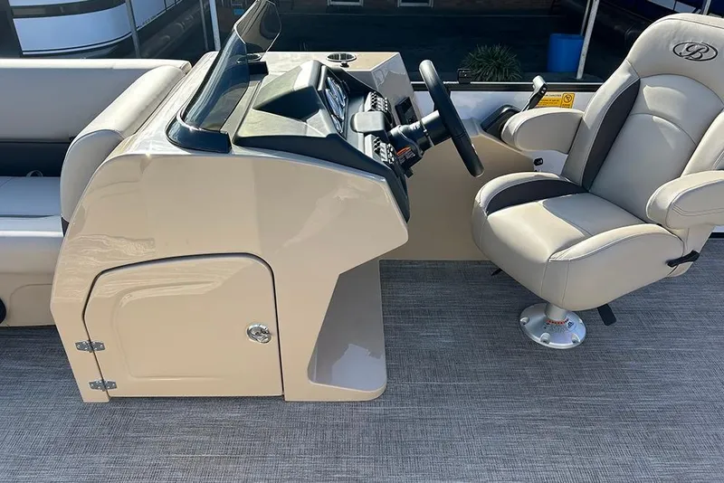 Slide: The Image of 2026 Bentley Pontoons Legacy 223 Swingback helm with captain's chair and control panel. - 18