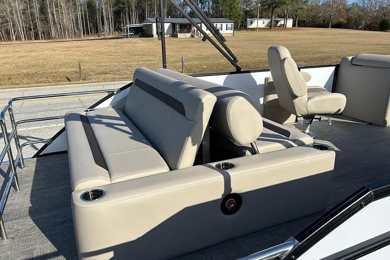 Slide: The Image of 2026 Bentley Pontoons Legacy 223 Swingback with beige seating and cup holders. - 22