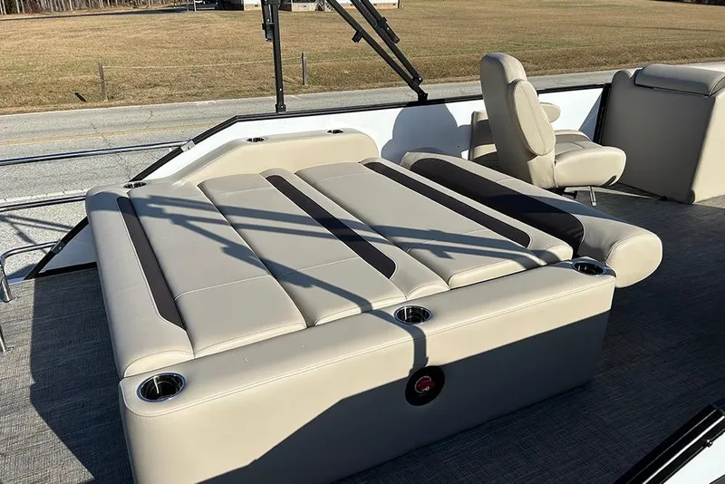 Slide: The Image of 2026 Bentley Pontoons Legacy 223 Swingback with luxurious seating and cup holders. - 24