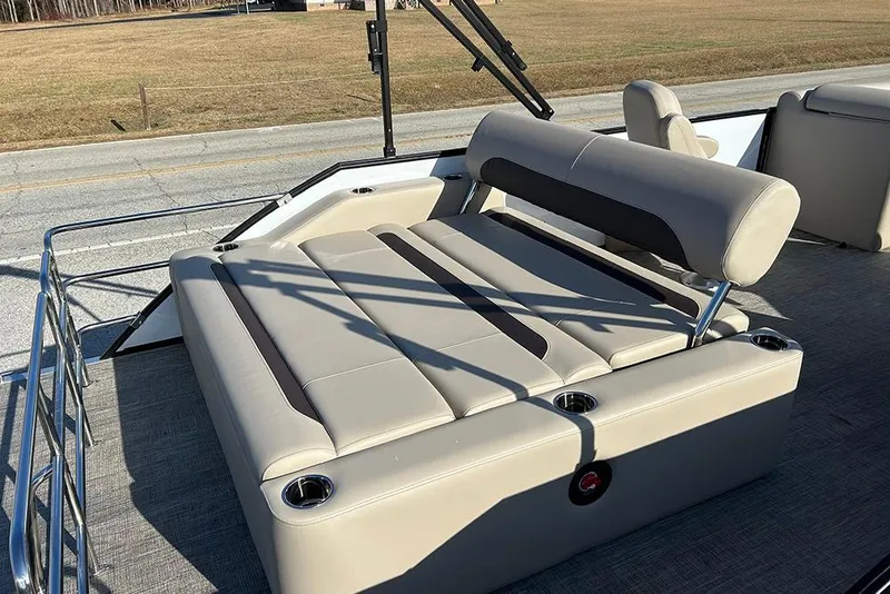 Slide: The Image of 2026 Bentley Pontoons Legacy 223 Swingback with luxurious seating and cup holders. - 26