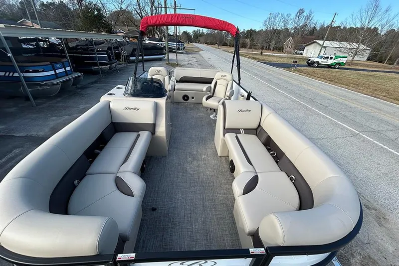 Slide: The Image of 2026 Bentley Pontoons Legacy 223 Swingback with spacious seating and red canopy. - 9