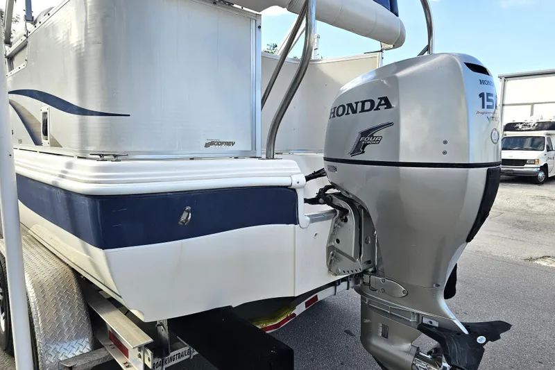Slide: The Image of 2005 Hurricane FunDeck 218 RE OB boat with Honda 150 outboard motor on trailer. - 10