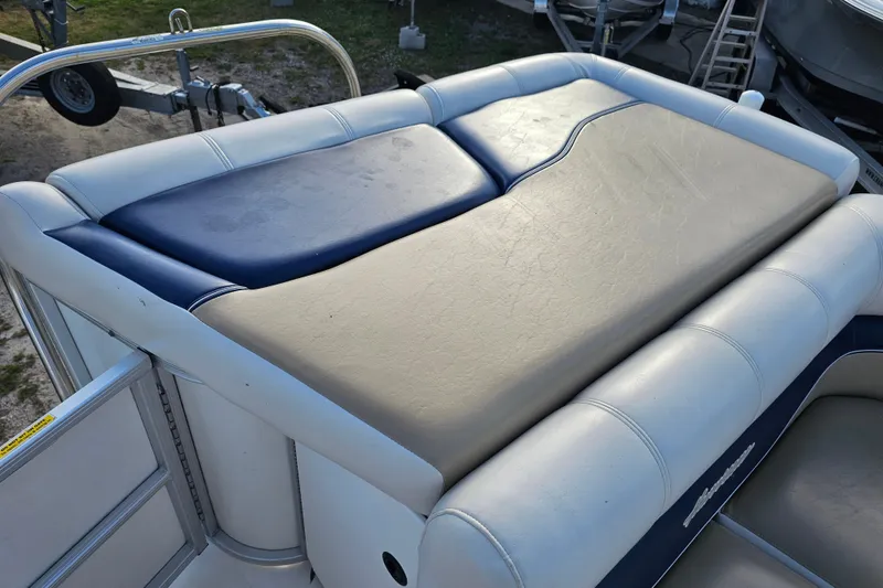 Slide: The Image of 2005 Hurricane FunDeck 218 RE OB boat seating with blue and beige upholstery. - 12
