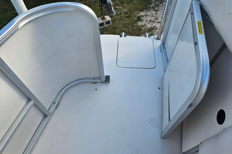 Slide: The Image of 2005 Hurricane FunDeck 218 RE OB boat deck with aluminum railings. - 13