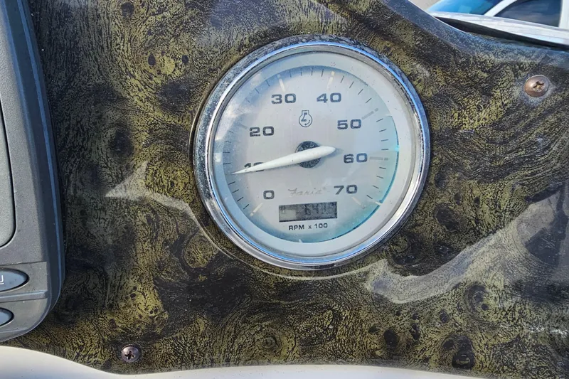 Slide: The Image of Close-up of a 2005 Hurricane FunDeck 218 RE OB speedometer on a textured dashboard. - 15