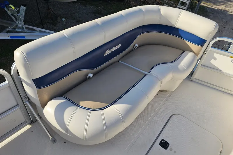 Slide: The Image of 2005 Hurricane FunDeck 218 RE OB boat seating with beige and blue upholstery. - 20