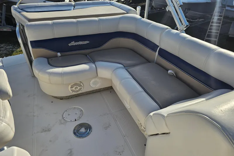 Slide: The Image of 2005 Hurricane FunDeck 218 RE OB boat interior with cushioned seating. - 23