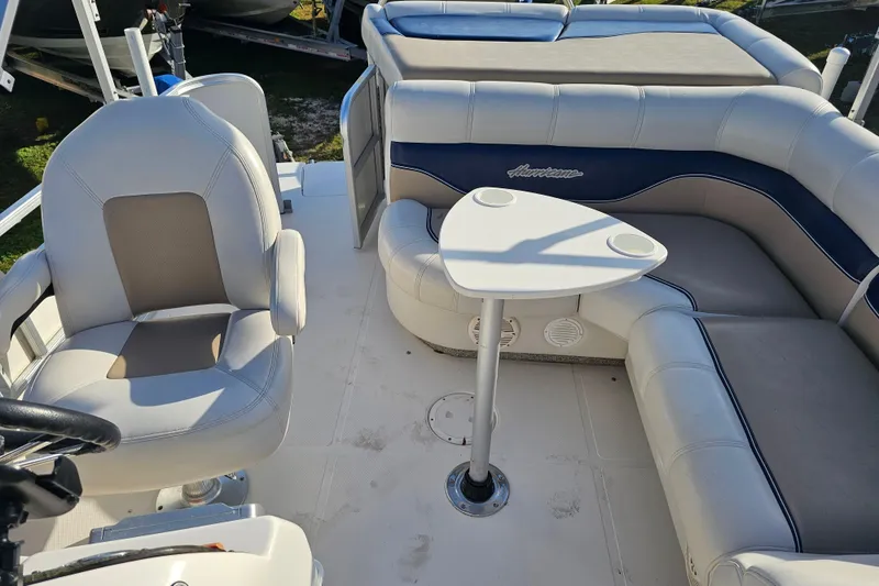 Slide: The Image of 2005 Hurricane FunDeck 218 RE OB boat interior with seating and table. - 26