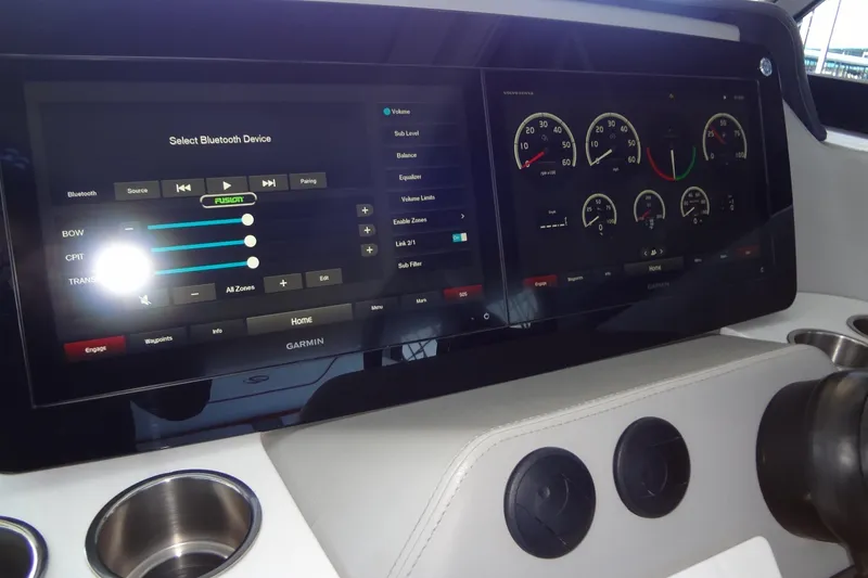 Slide: The Image of 2022 Regal LS36 dashboard with touchscreen controls and gauges, featuring Garmin interface. - 16