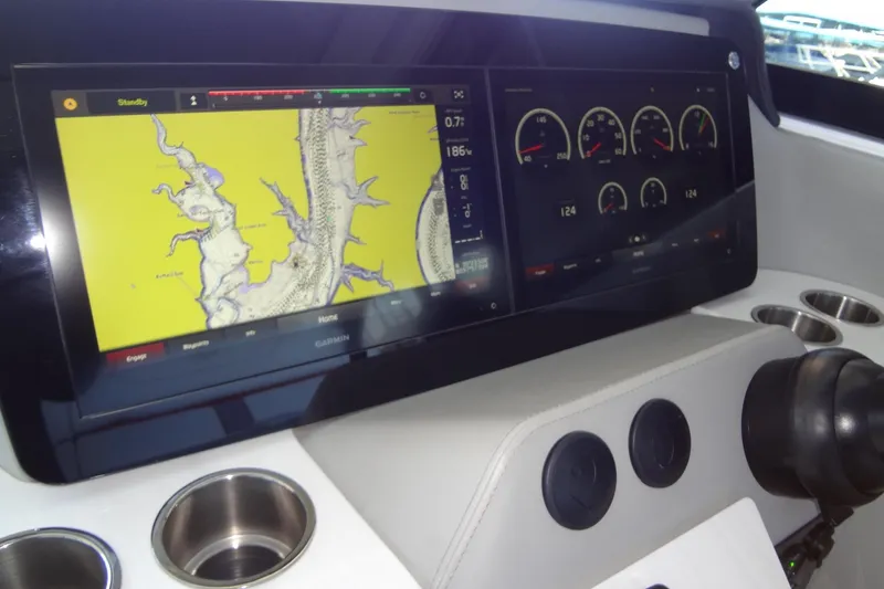 Slide: The Image of Dashboard of 2022 Regal LS36 boat with navigation and control displays. - 17