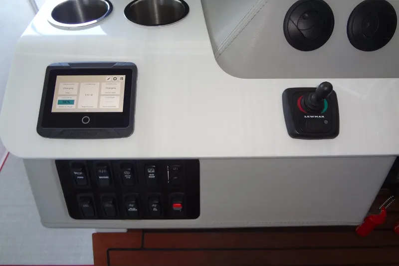 Slide: The Image of Control panel of 2022 Regal LS36 boat with touchscreen and joystick. - 19