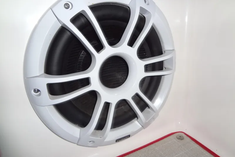 Slide: The Image of White speaker on 2022 Regal LS36 boat interior. - 32