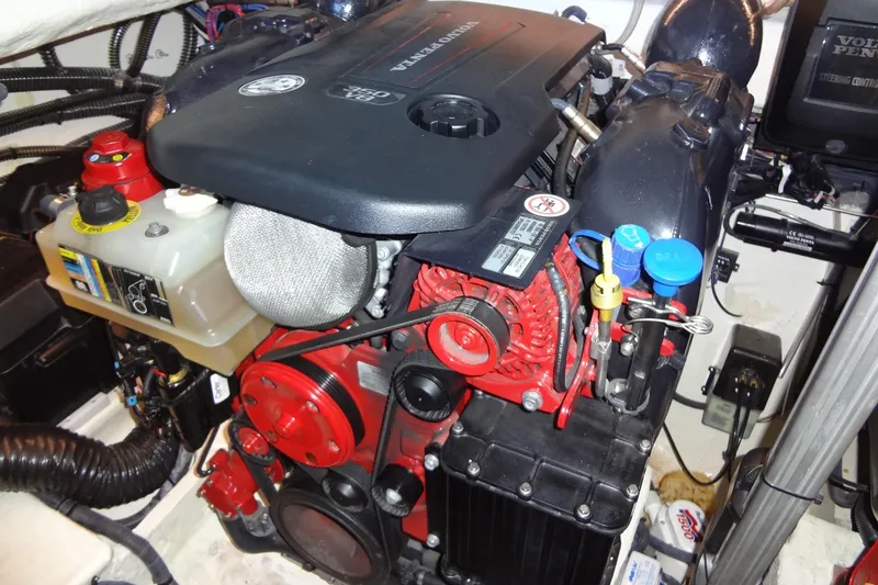 Slide: The Image of Engine compartment of a 2022 Regal LS36 boat, featuring a Volvo Penta engine. - 36