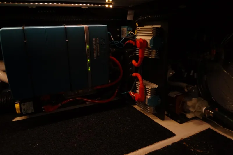 Slide: The Image of Electrical components inside a 2022 Regal LS36 boat, featuring a blue power unit. - 40