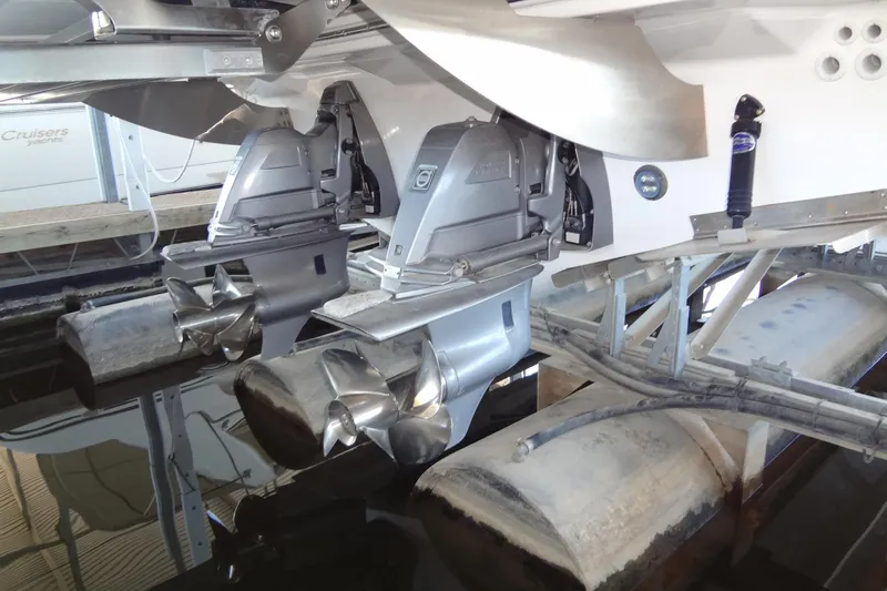 Slide: The Image of 2022 Regal LS36 boat with dual outboard motors and propellers in a marina. - 42