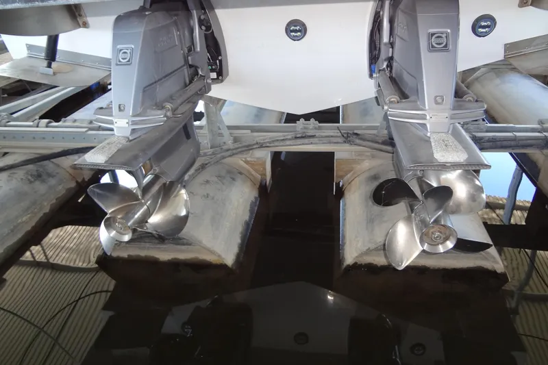 Slide: The Image of 2022 Regal LS36 boat with dual propellers in a dry dock setting. - 43