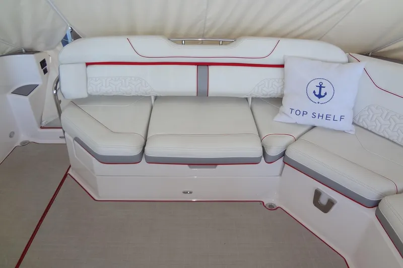 Slide: The Image of Luxurious seating on 2022 Regal LS36 boat with "Top Shelf" pillow. - 6