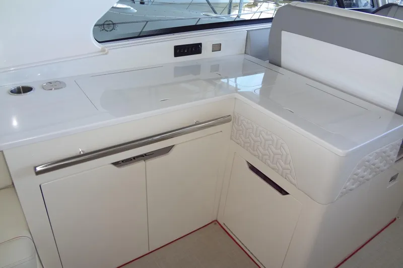 Slide: The Image of 2022 Regal LS36 yacht interior with sleek white cabinetry and modern design. - 9