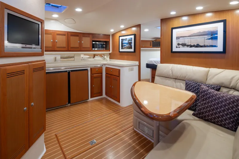 Slide: The Image of Luxurious interior of a 2006 Cabo 40 Express yacht with modern amenities. - 13