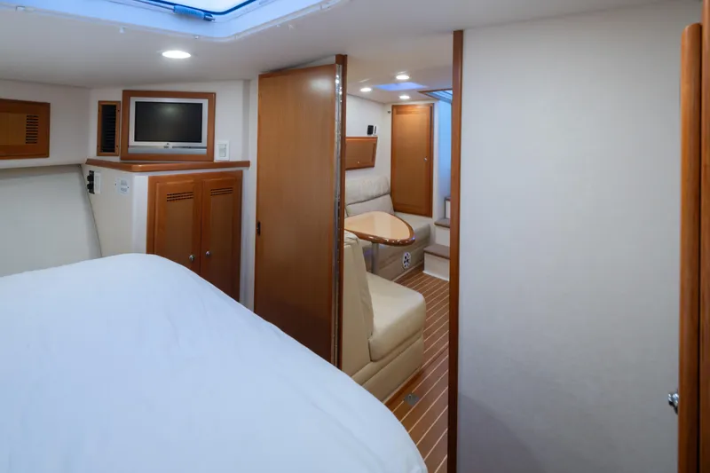 Slide: The Image of Interior of 2006 Cabo 40 Express yacht with cozy seating and modern amenities. - 23