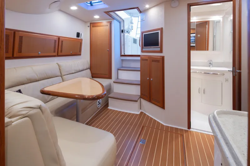 Slide: The Image of Luxurious interior of 2006 Cabo 40 Express yacht with elegant wood finishes. - 25