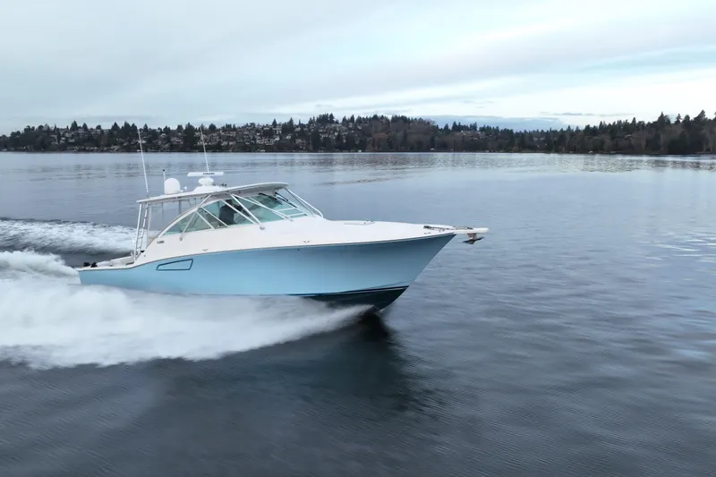 Slide: The Image of 2006 Cabo 40 Express Sportfish cruising on calm waters. - 3