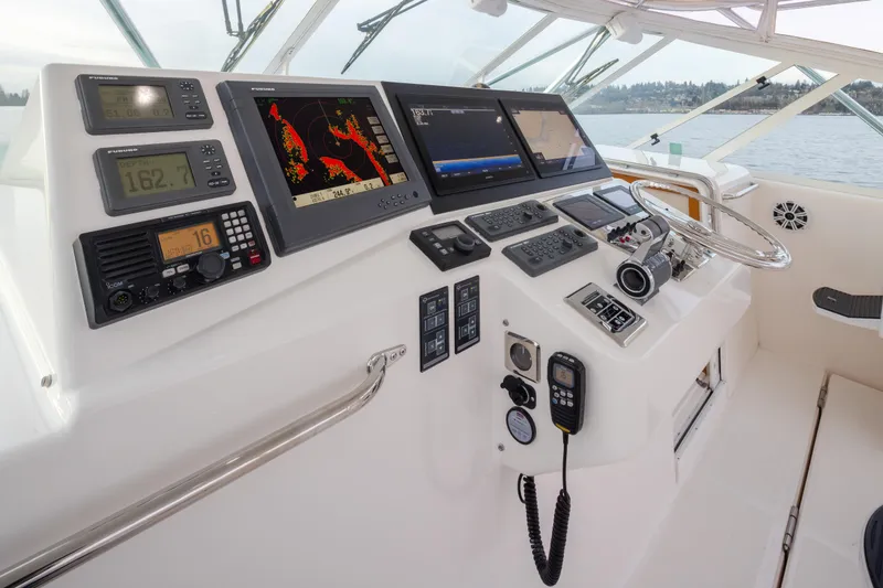 Slide: The Image of Helm of 2006 Cabo 40 Express boat with navigation and communication equipment. - 31