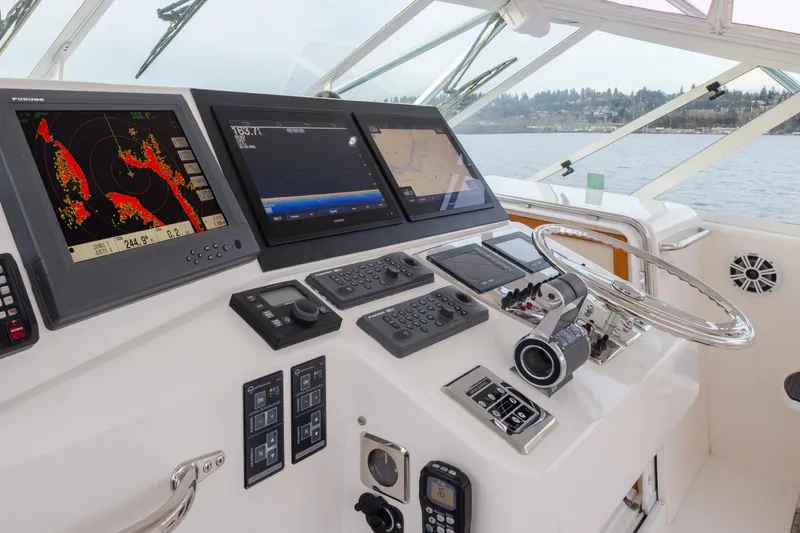 Slide: The Image of Helm of 2006 Cabo 40 Express yacht with advanced navigation systems. - 32