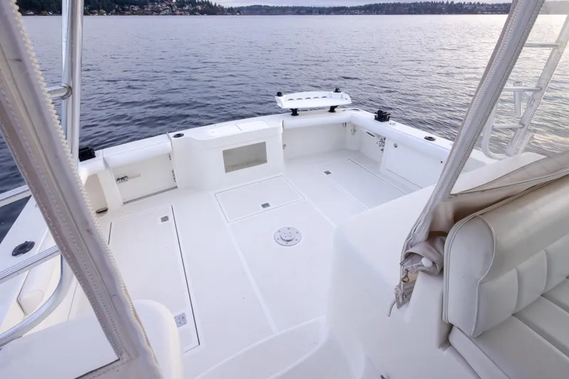 Slide: The Image of 2006 Cabo 40 Express boat deck with seating, overlooking calm waters. - 35