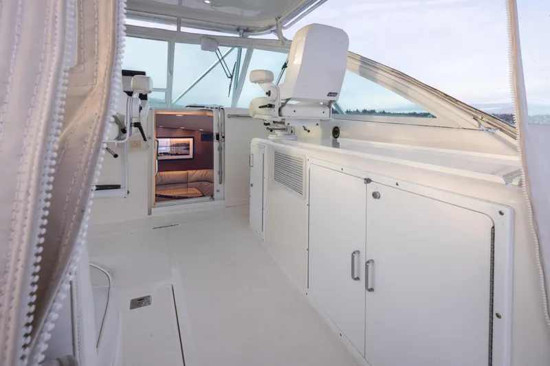 Slide: The Image of 2006 Cabo 40 Express yacht interior with white seating and cabinetry. - 37