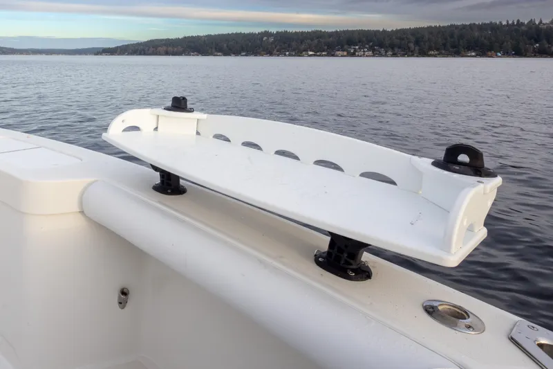 Slide: The Image of 2006 Cabo 40 Express boat with rod holder on calm water. - 38