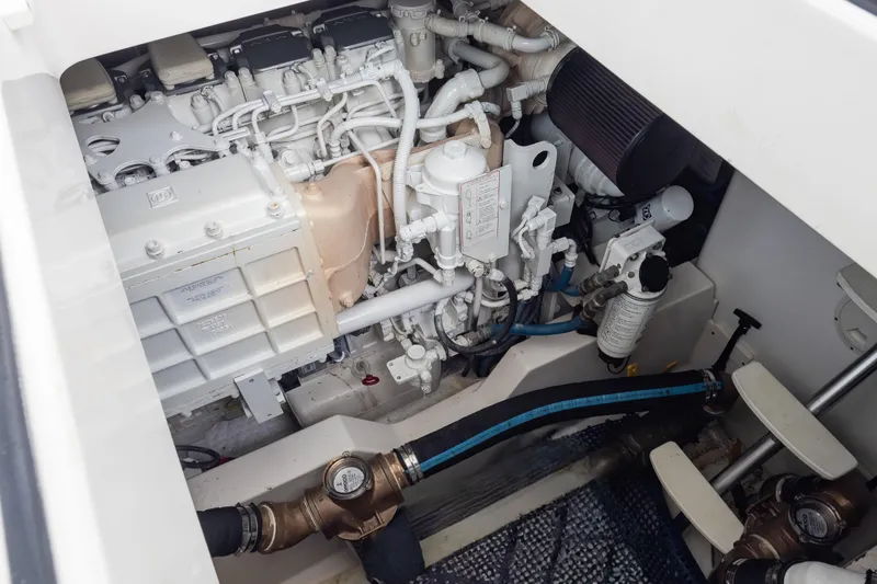 Slide: The Image of Engine compartment of a 2006 Cabo 40 Express boat, showcasing detailed mechanical components. - 41
