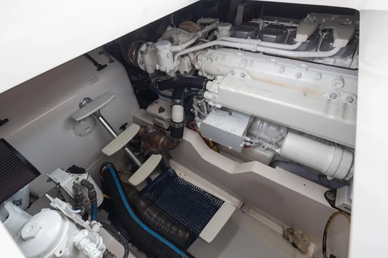 Slide: The Image of Engine compartment of a 2006 Cabo 40 Express boat, showcasing mechanical components. - 42