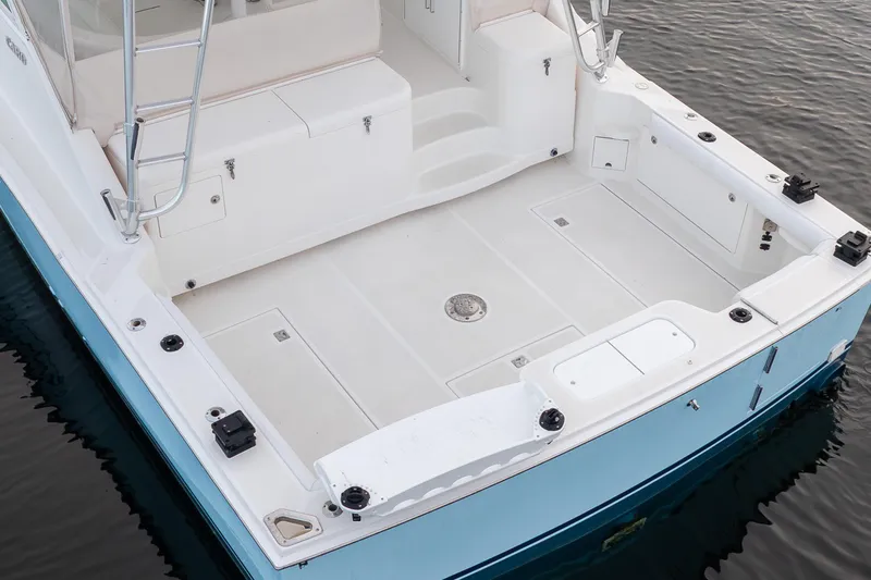 Slide: The Image of 2006 Cabo 40 Express boat deck with spacious layout and clean design. - 9