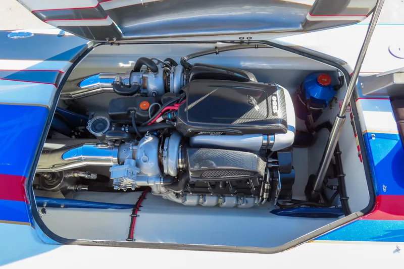Slide: The Image of Engine compartment of a 2016 Skater 388 boat, featuring a powerful Mercury engine. - 14