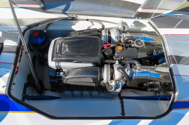 Slide: The Image of High-performance engine of a 2016 Skater 388 boat, showcasing intricate mechanical details. - 16