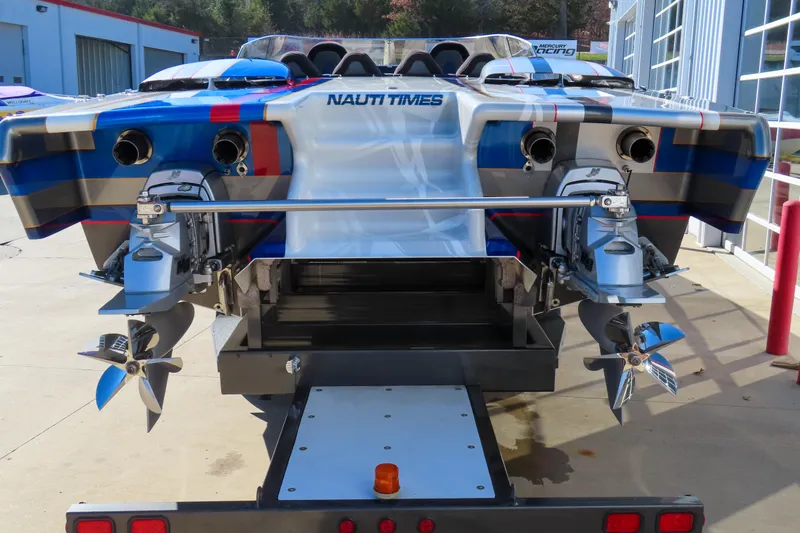 Slide: The Image of Rear view of 2016 Skater 388 powerboat with dual outboard engines and vibrant design. - 5