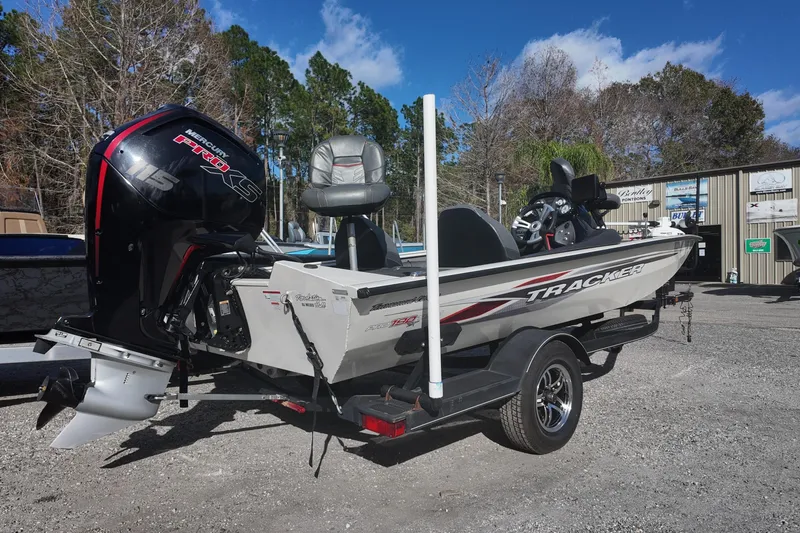 Slide: The Image of 2021 Tracker Pro Team 190 TX boat with Mercury 115 Pro XS engine on trailer. - 2