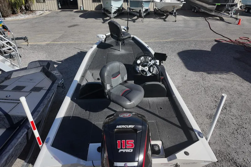 Slide: The Image of 2021 Tracker Pro Team 190 TX boat with Mercury 115 Pro engine, parked outdoors. - 4