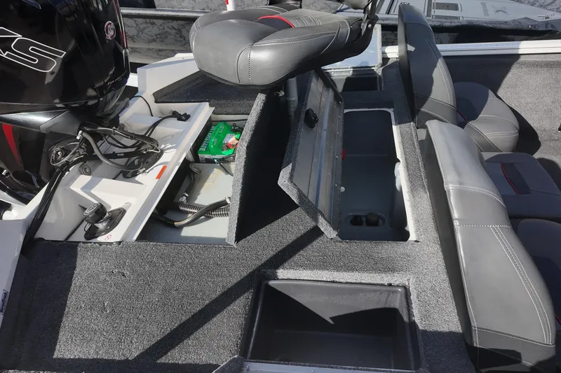 Slide: The Image of 2021 Tracker Pro Team 190 TX boat interior with storage compartments and seating. - 6