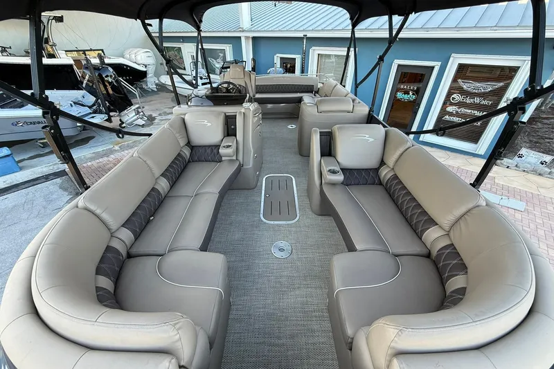 Slide: The Image of 2018 Bennington 25 QSB pontoon boat with spacious seating and modern interior design. - 12