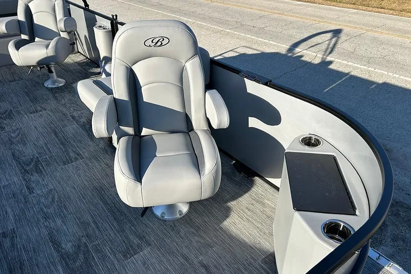 Slide: The Image of 2026 Bentley Pontoons Fish 243 Swingback interior with luxurious seating and cup holders. - 17