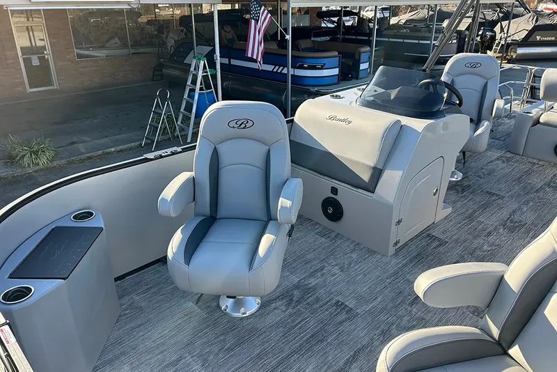 Slide: The Image of 2026 Bentley Pontoons Fish 243 Swingback interior with plush seating and modern helm. - 18