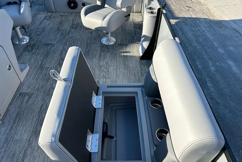 Slide: The Image of 2026 Bentley Pontoons Fish 243 Swingback interior with open storage compartment and seating. - 23