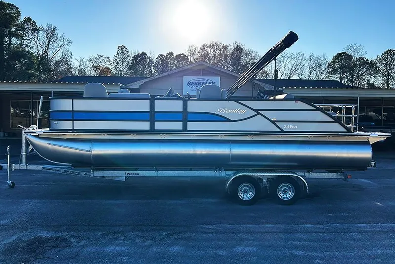 Slide: The Image of 2026 Bentley Pontoons Fish 243 Swingback on trailer, parked outdoors. - 4