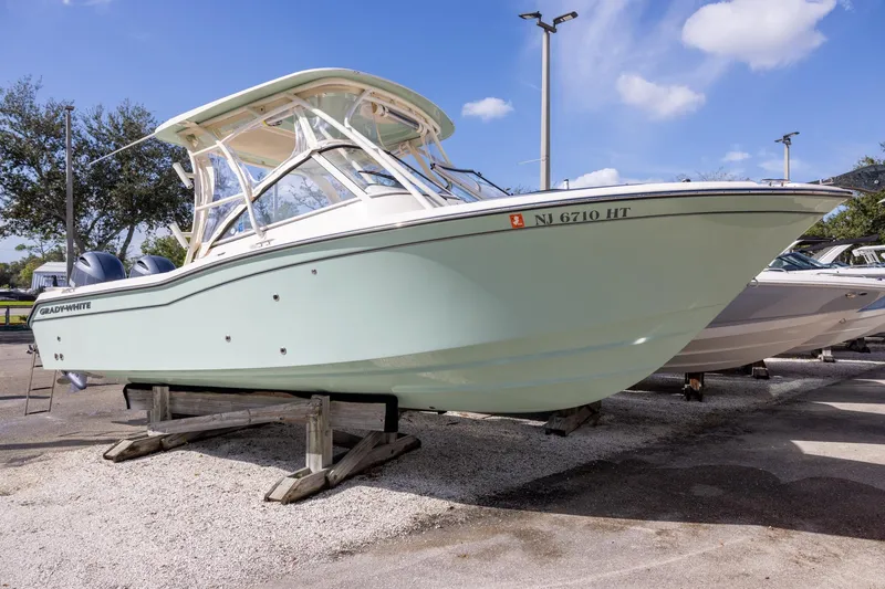 The Image of 2023 Grady-White Freedom 255 boat on display, parked on a stand outdoors. - 0